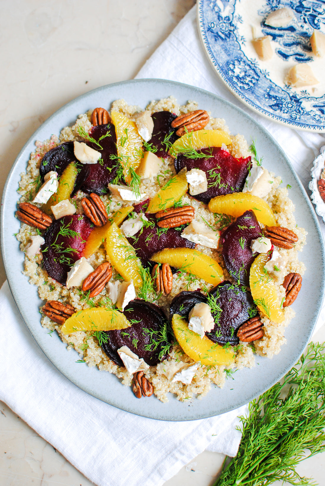Winter salad with quinoa, orange, beetroot, pecan nuts and a brie style vegan cheese